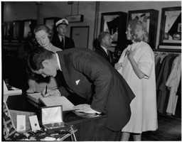 Ted Kennedy, brother of the President of the United States, signs visitors book