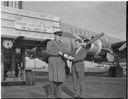 Seaboard & Western Air (S&W) unloading whiskey shipment