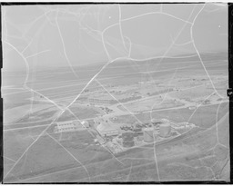 Aerial of development site with tanks in foreground