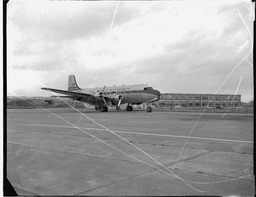 Plane in front of Progress International Factory