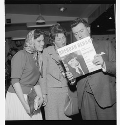 Brendan Behan, his wife, and Miss Cecilia-Seldheld at Gramaphone Counter