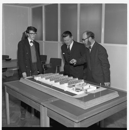 Mr Brendan O'Regan, Mr Hudson and his Son, with model of factory