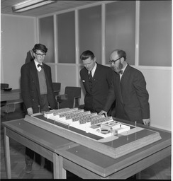 Mr Brendan O'Regan, Mr Hudson and his Son, with model of factory