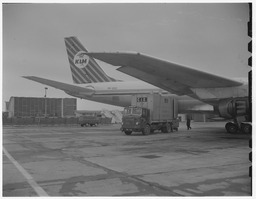 CIE freight truck at KLM Royal Dutch Airlines plane