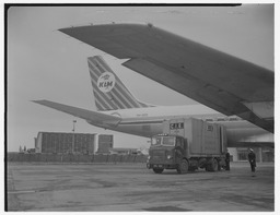 CIE freight truck at KLM Royal Dutch Airlines plane