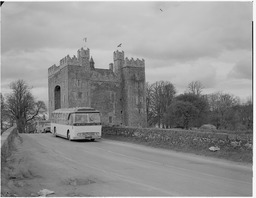 Tourist bus in front of bridge at Bunratty Castle