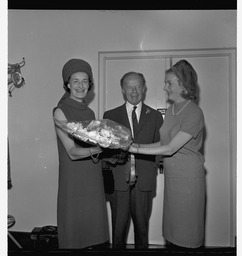 Mrs Murphy presenting flowers to Mr Childers