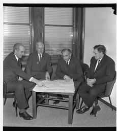 Canadian Ambassador sitting at table