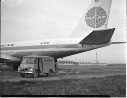 Pan American Airlines (PAA) Boeing 707 jet with restaurant van on tarmac (1)