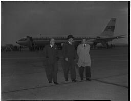 Frank Aiken, Minister of Eastern Affairs, with airport manager and on the ramp