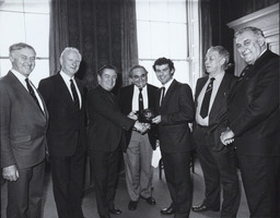 [Justin Keating presenting an award to Tony Ward.]