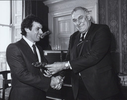 [Dónal O'Sullivan presenting an award to Tony Ward.]