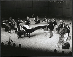 Micheal O Suilleabhain and orchestra performing at patron's premiere gala at University Concert Hall