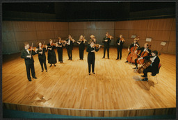 String orchestra performing on stage [at University Concert Hall?]