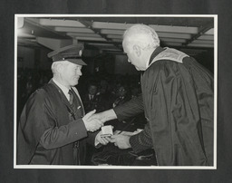 Paul Quigley presents distinguished performance silver medal to Michael John Francis