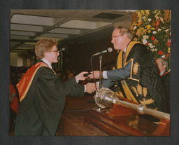 John Daly presents distinguished performance silver medal award to David McTague