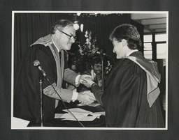 John Daly presents distinguished performance gold medal award to Brendan J. Doyle