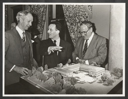 Edward Walsh, Padraig Berry and John Daly examining a model of a new hotel complex