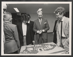 Group with Edward Walsh viewing a model of IDA's International Business Centre