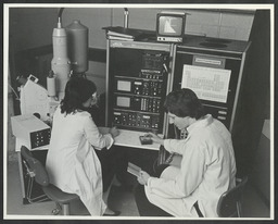 Students in a science laboratory [mechanical engineering?]