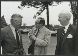 Small groups of men at unidentified events