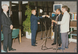 AV unit activities including Christmas party 1995, event in Glucksman Library, computer and lab equipment, staff portraits, Stables courtyard