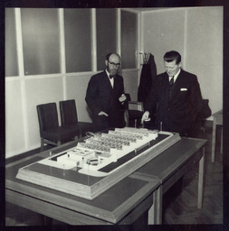 Mr. Brendan O'Regan, Mr. Hudson and his son, with model of factory