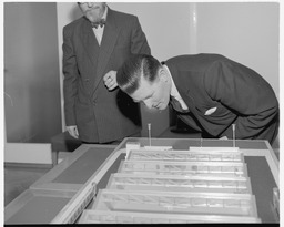 Mr. Brendan O'Regan and Mr. Hudson with model of factory