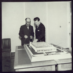 Mr. Brendan O'Regan, Mr. Hudson and his son, with model of factory