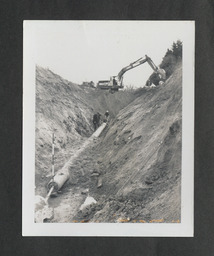 Black and white prints (85 x 110 mm) of the laying of main sewer at campus; top of a column at Plassey House and the grounds of Plassey House. Photographs taken by the President.