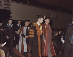 [Procession of academics and Governing Body members at TCE graduation ceremony.]