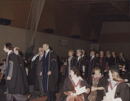 [Members of Governing Body in procession at graduation ceremony.]