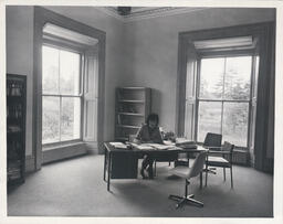 Mary McGuire at her desk in Plassey House