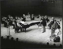 Mícheál Ó Súilleabháin and orchestra performing at patron's premiere gala at University Concert Hall