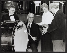 People with a large drum in Foundation Building