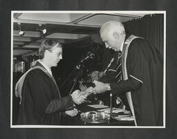 Paul Quigley presents distinguished performance silver medal to Killian Logan