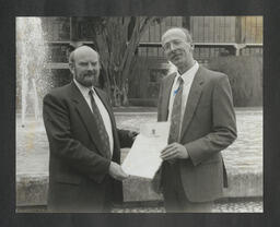 Dr Stuart Hampshire presenting an award for research to Dr Seamus McMonagle