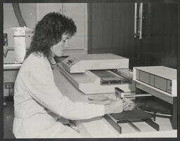 SMT Engineer Eileen Goold assembles a prototype SMT board