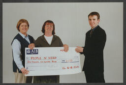 Presentation of a cheque to People in Need