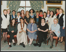 Shots of students on campus and [staff?] in front of Plassey House labelled "Fionnuala Wange group - international women's studies" and "Architects Glucksman Ind.Bio Chem."