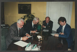 Group shots of Dr Ed Walsh and others in various settings: meeting room, chatting in Plassey House, from envelope labelled "University Commission, First Meeting, July 97"