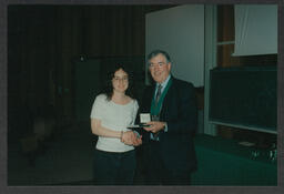 Award ceremony and shots of individual giving presentation/talk labelled "Irish universities chemistry convention June 1996 Tim Smyth"