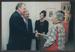 Professor Serge Riviére with attendees at the French Ambassador Exhibition Opening 