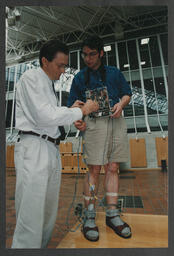 Technical equipment labelled Earthquake machine and Electron[ic?] Feb 2000" and "Ian G[rout?]," grass labelled "Michael Hayes Grass Research C.E.S and student with electrical sensory wiring attached