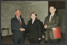 SProfessor Eoin Reeves, Professor Noel Whelan with an individual at the College of Business Research Conference