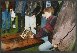 Shots of students conducting an experiment, [Physical disability aids for young children?],Various unidentified objects labelled "Sarah Cox M + AE" and "Mark Davies M + AE"