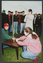 Shots of students conducting an experiment, [Physical disability aids for young children?],Various unidentified objects labelled "Sarah Cox M + AE" and "Mark Davies M + AE"