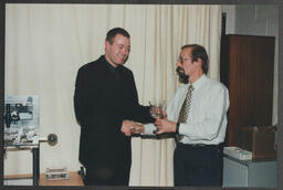 An award presentation by Professor Ted Little to a student at the University of Limerick