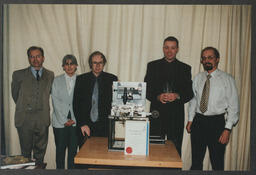 A group portrait of attendees at an award presentation by Professor Ted Little