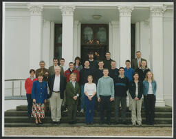 A group portrait of Charlotte Tuohy and others in front of Plassey House at the University of Limerick